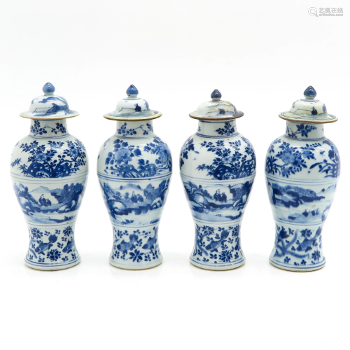 Four Blue and White Vases with Covers