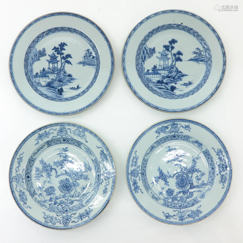 A Collection of Four Blue and White Plates