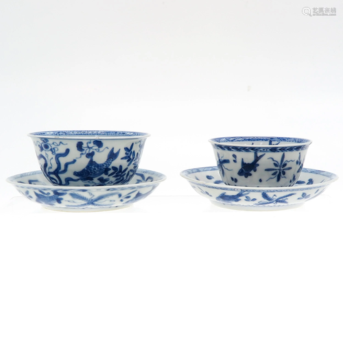 Two Blue and White Cups and Saucers