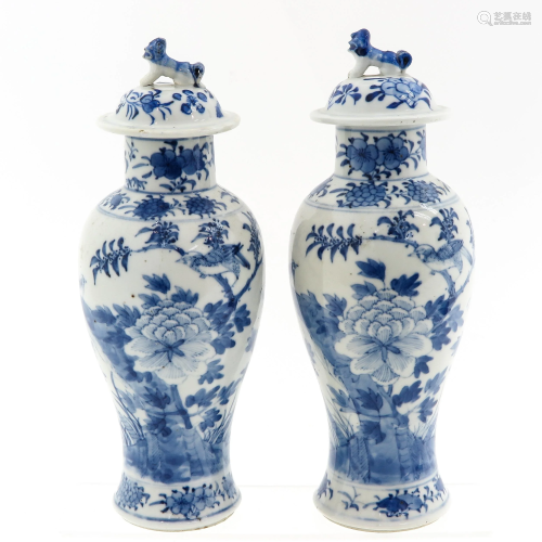 A Pair of Garniture Vases with Covers