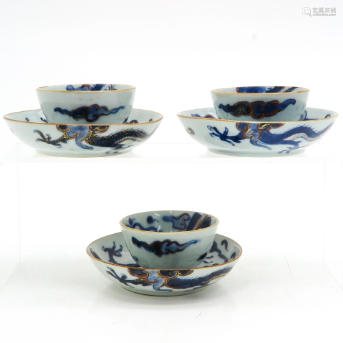 Three Blue and White Cups and Saucers