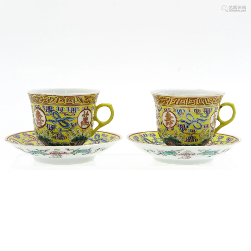 Two Famille Jaune Cups and Saucers