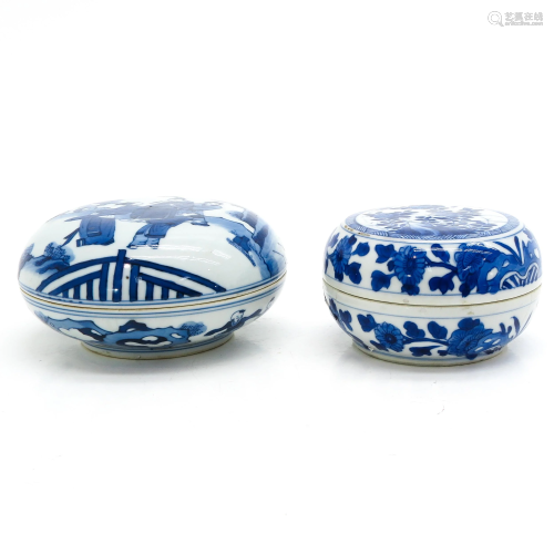 Two Blue and White Round Boxes