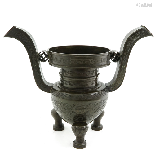 A Chinese Bronze Tripod Censer