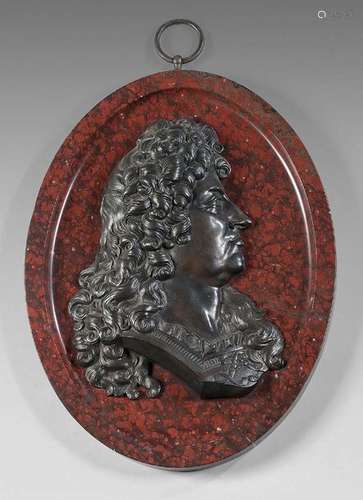 Profile of Louis XIV in patinated bronze on a red …