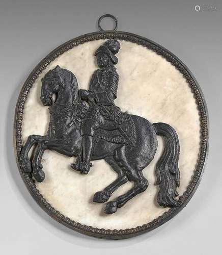 Large medallion decorated with a cast iron rider o…