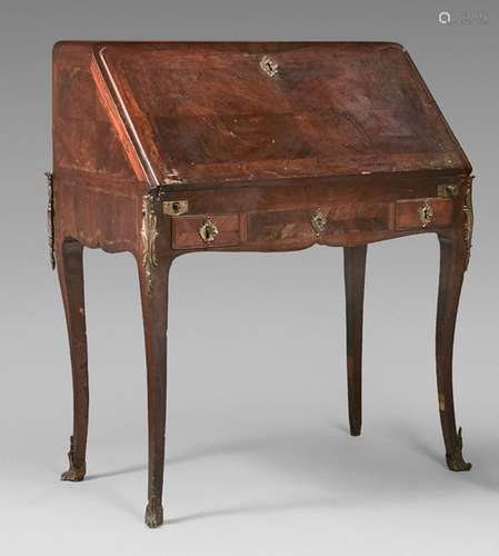 Sloping desk in rosewood veneer opening to a flap …