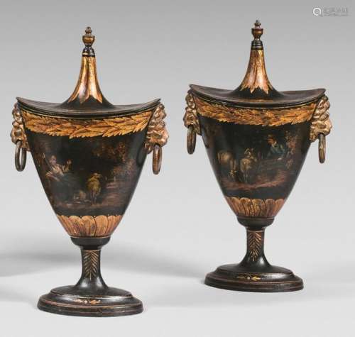 Pair of covered pewter crest shaped urns decorated…