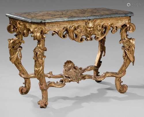 Gilded wood console richly carved with mascarons, …