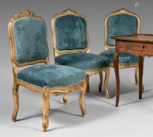 Three chairs with flat backs in gilded wood carved…