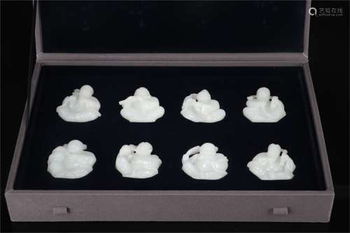 A Set of Eight Chinese Carved Jade Decorations