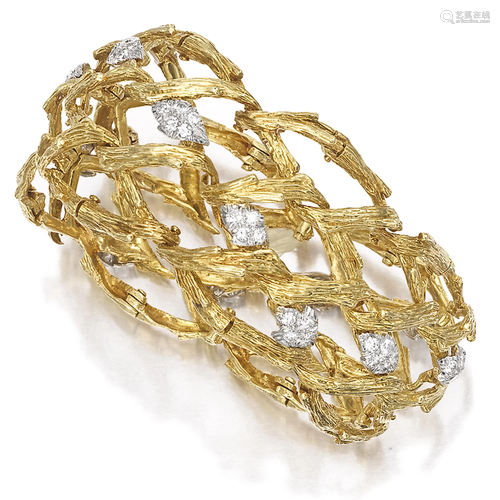 An eighteen karat gold and diamond bracel…