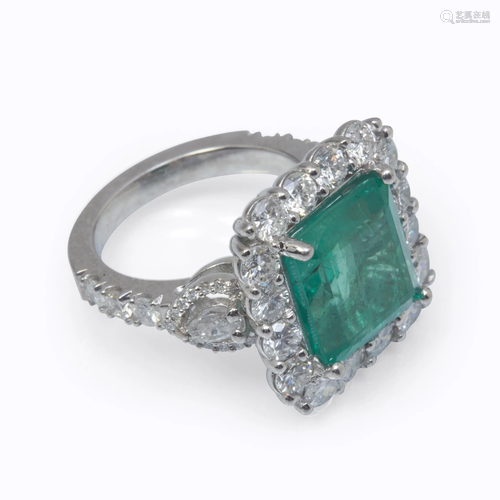 An emerald, diamond, and eighteen k…