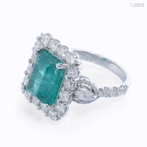 An emerald, diamond, and eighteen k…