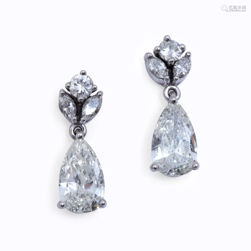 A pair of diamond and platinum drop earrings,