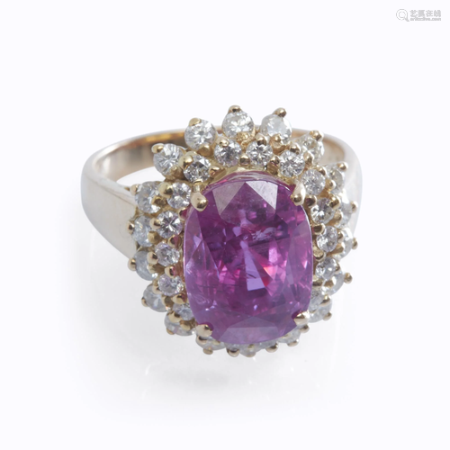 A pink sapphire, diamond, and fourteen ka…