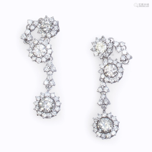 A pair of diamond and eighteen karat white …