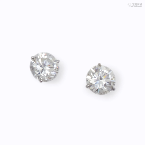 A pair of diamond earrings,