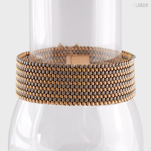 A woven eighteen karat bi-color gold strap …