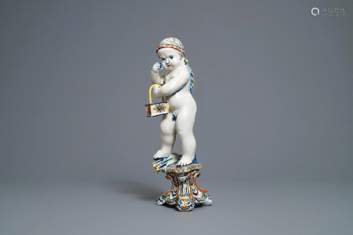 A polychrome Dutch Delft model of a boy, alle…