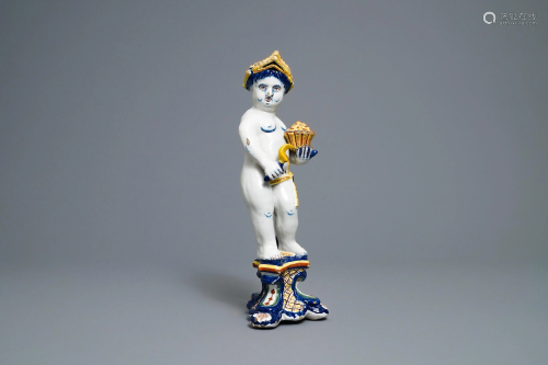 A polychrome Dutch Delft model of a boy, alle…