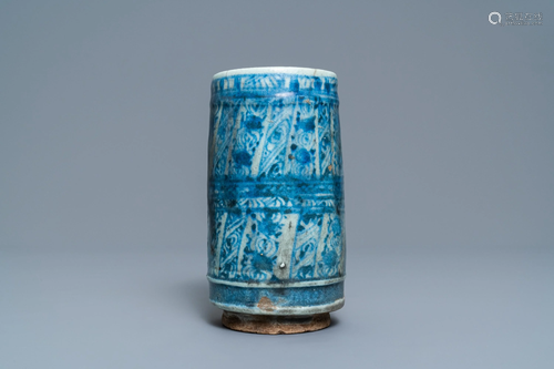 A blue and white cylindrical Islamic pottery …