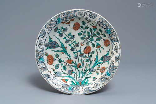 A polychrome Iznik dish with floral design, T…