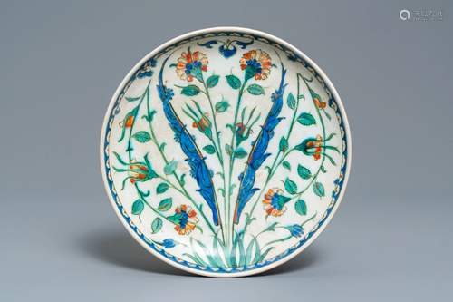 A polychrome Iznik dish with floral design, T…