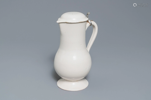 A white Delftware jug and cover, 18th C.