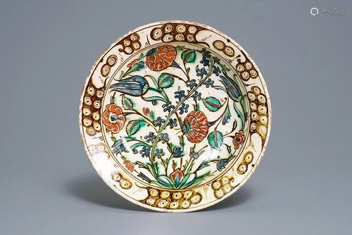 A polychrome Iznik dish with floral design, T…