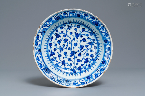 A blue and wite Iznik dish with floral desi…