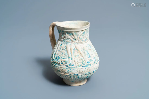 A Persian turquoise-glazed moulded calligrap…