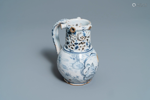 A blue and white Lille faience puzzle jug, 1…