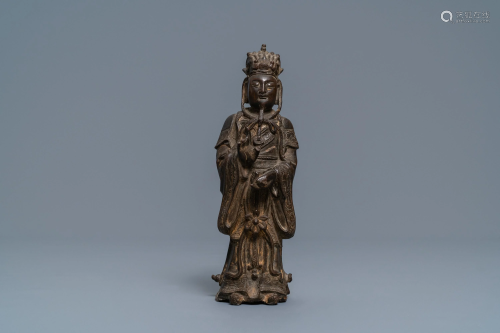 A Chinese bronze figure of a dignitary, Ming