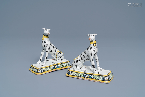 A pair of polychrome Brussels faience models of