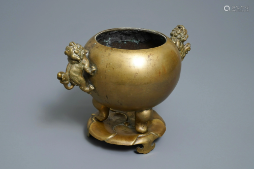 A large Chinese bronze tripod censer on …