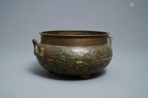 A large Chinese bronze tripod censer with…