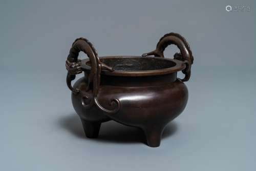 A Chinese bronze chilong-handled tripod c…