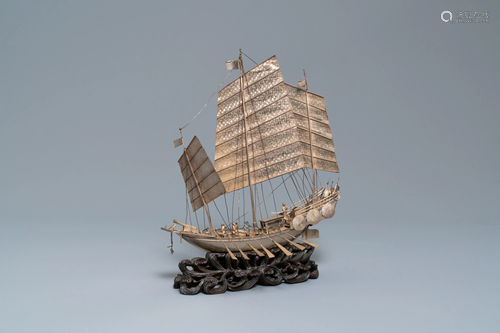 A large Chinese silver model of a junk on…