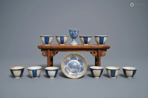 Ten Chinese blue and white cups, a stem …