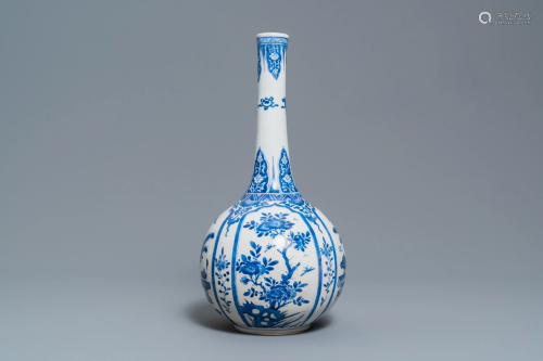 A Chinese blue and white bottle vase with flo…
