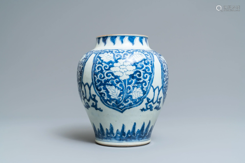 A Chinese blue and white vase with floral pa…