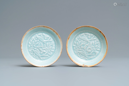 A pair of Chinese qingbai moulded saucer …