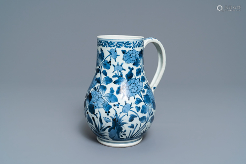 A Japanese blue and white Arita mug with flor…