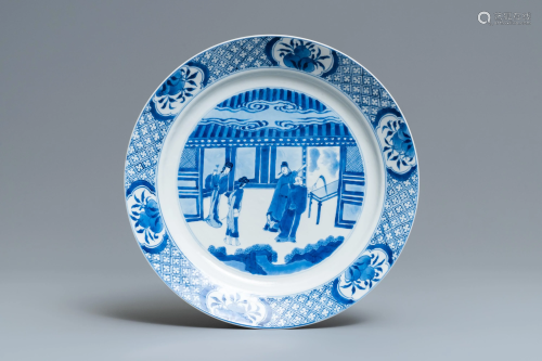 A Chinese blue and white dish with figures in…