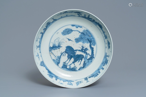 A Chinese blue and white charger with two …