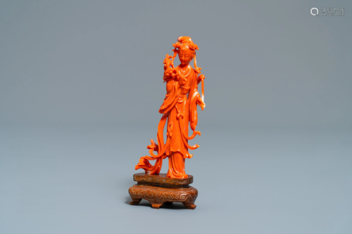 A Chinese carved coral figure of a lady wi…