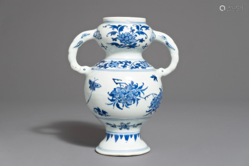 A Chinese blue and white vase with floral de…