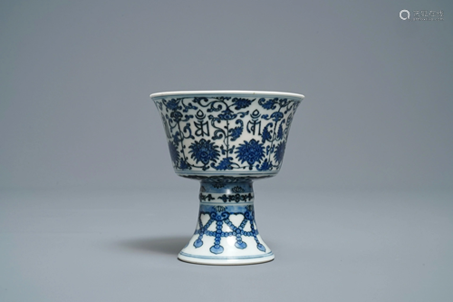 A Chinese inscribed blue and white stem cup,…