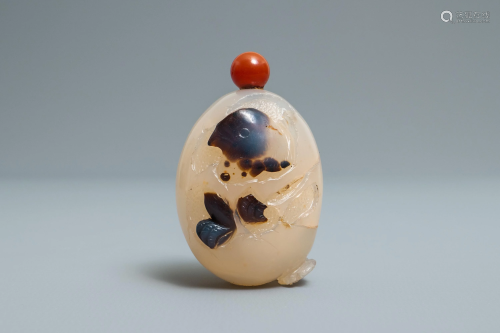 A Chinese carved agate snuff bottle with a …